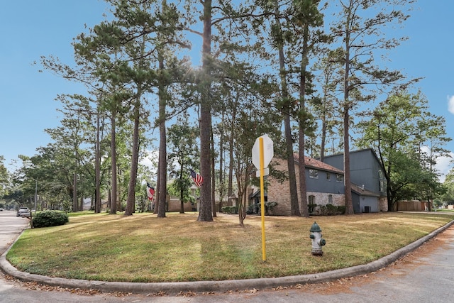 view of home's exterior with a yard