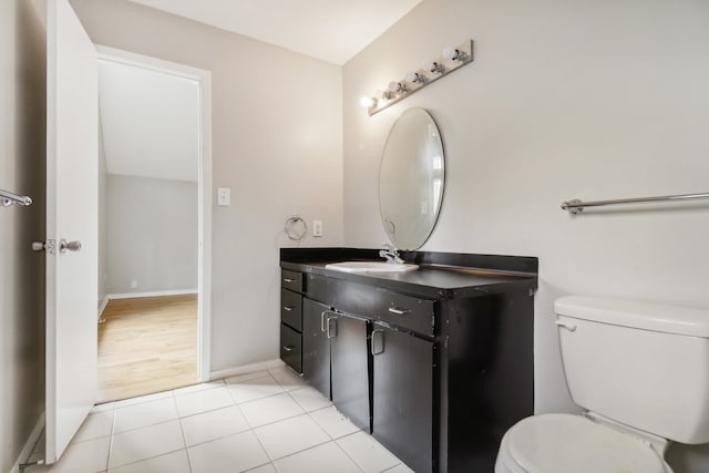 bathroom with hardwood / wood-style floors, vanity, and toilet