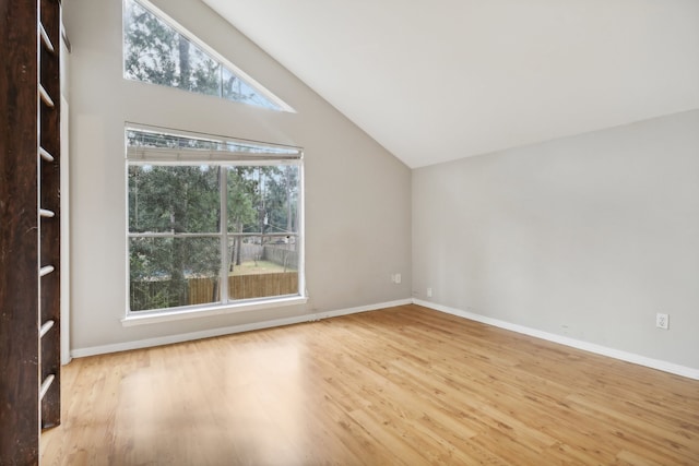 bonus room with high vaulted ceiling and light hardwood / wood-style floors