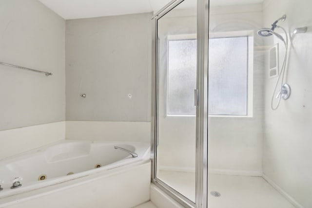 bathroom with separate shower and tub