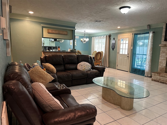 living room featuring light tile patterned flooring, ornamental molding, and a textured ceiling