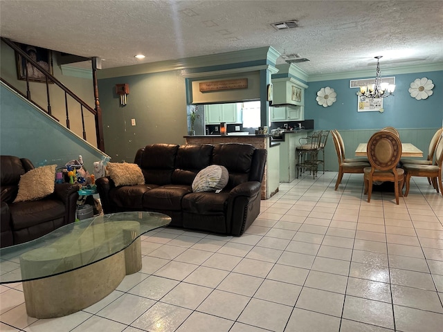 12419 Longbrook Dr, Houston, TX 77099 - living area with a textured ceiling, visible vents, an inviting chandelier, ornamental molding, and light tile patterned flooring