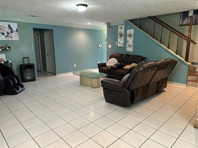 12419 Longbrook Dr, Houston, TX 77099 - living room featuring crown molding, visible vents, light tile patterned flooring, stairway, and a textured ceiling