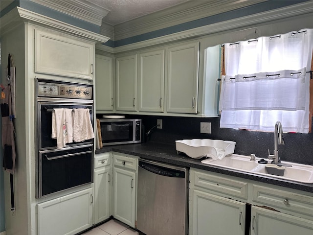 12419 Longbrook Dr, Houston, TX 77099 - kitchen featuring a sink, dark countertops, light tile patterned floors, and stainless steel appliances