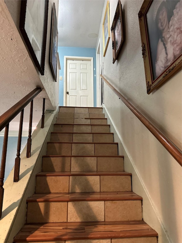 12419 Longbrook Dr, Houston, TX 77099 - stairway with a textured wall