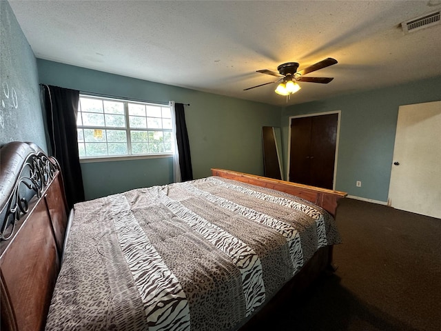 12419 Longbrook Dr, Houston, TX 77099 - carpeted bedroom featuring a ceiling fan, a textured ceiling, and visible vents