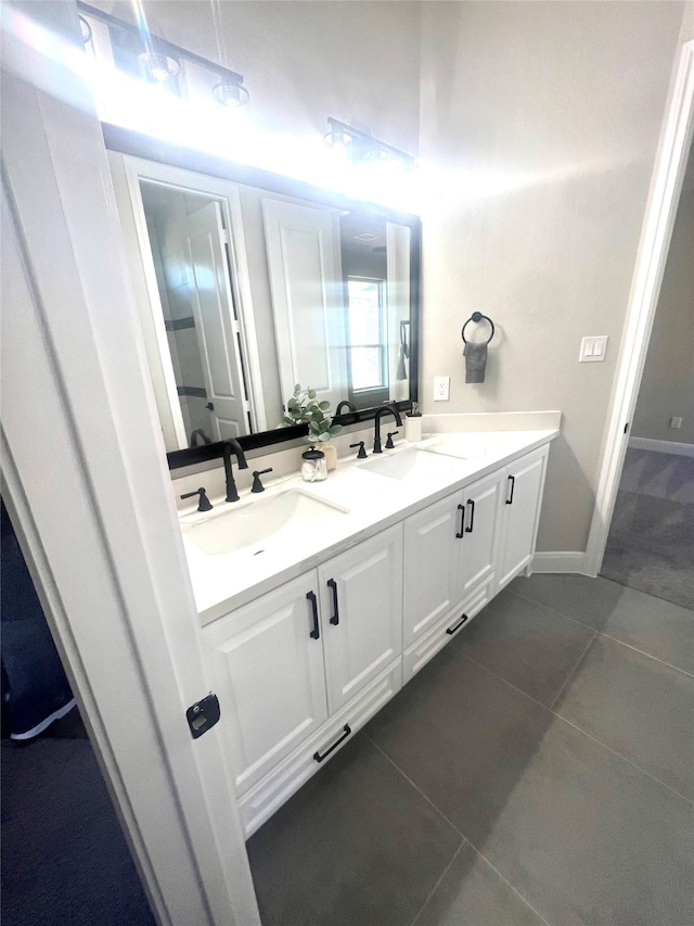 bathroom with vanity and tile patterned flooring