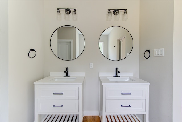 bathroom featuring vanity and hardwood / wood-style floors