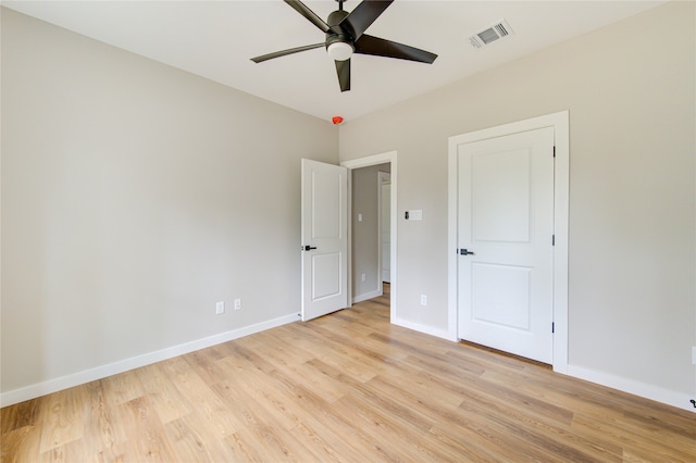 spare room featuring ceiling fan and light hardwood / wood-style floors