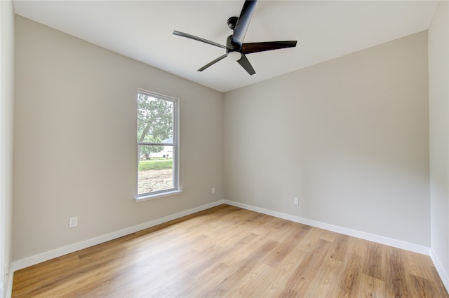 empty room featuring ceiling fan and light hardwood / wood-style floors