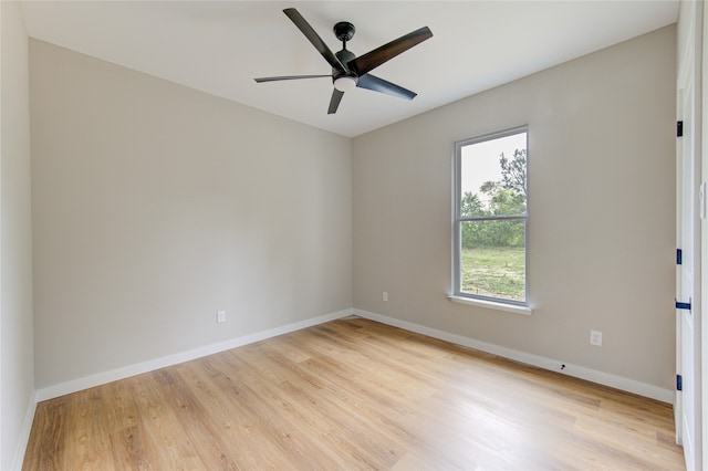 spare room featuring ceiling fan and light hardwood / wood-style flooring