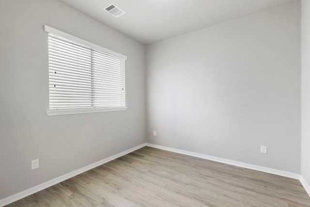 spare room featuring light hardwood / wood-style flooring