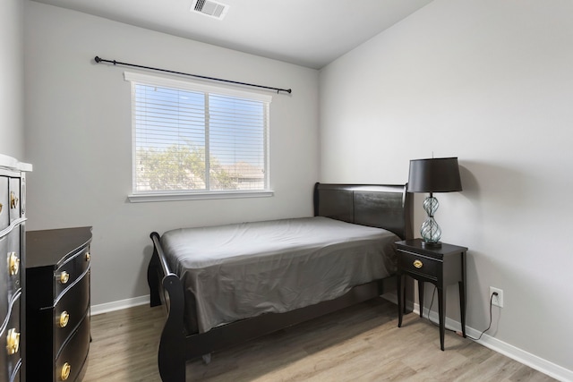 bedroom with wood-type flooring