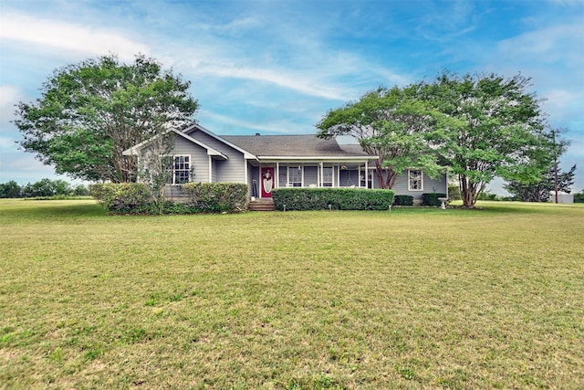 ranch-style house featuring a front lawn