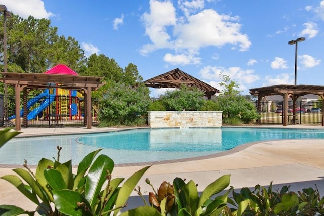 view of pool featuring a pergola and a patio