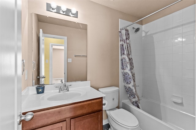 full bathroom with vanity, shower / bath combination with curtain, and toilet