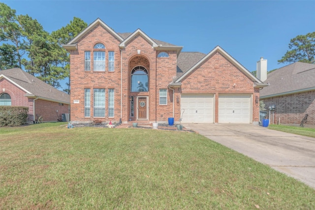 front of property with a front lawn and a garage