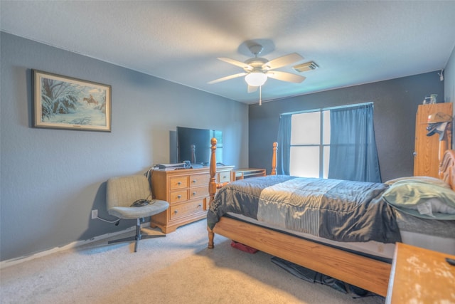 bedroom featuring light colored carpet and ceiling fan