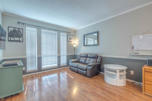 living room featuring hardwood / wood-style floors and ornamental molding