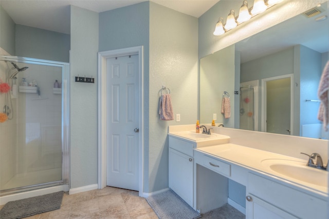 bathroom featuring vanity and a shower with shower door