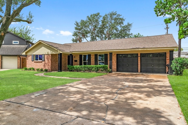 single story home with a front yard and a garage