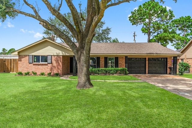 single story home with a garage and a front lawn