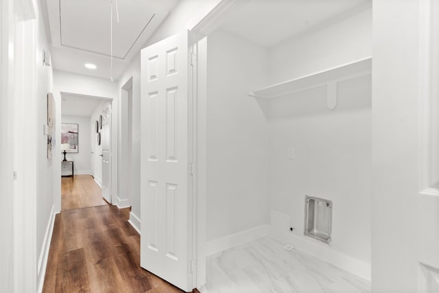 hallway with wood-type flooring