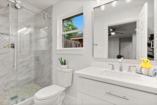 bathroom with ceiling fan, an enclosed shower, vanity, and toilet