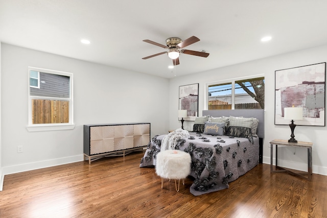 bedroom featuring dark hardwood / wood-style flooring and ceiling fan