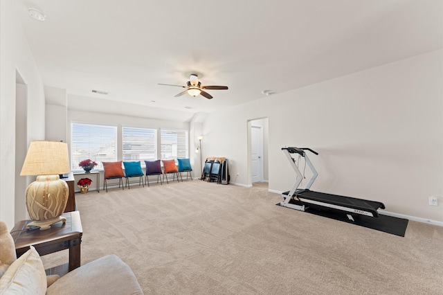 workout area featuring light carpet and ceiling fan