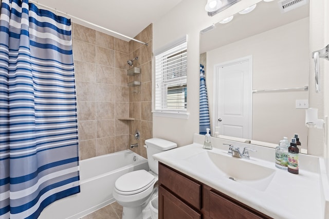 full bathroom with shower / tub combo with curtain, tile patterned floors, vanity, and toilet