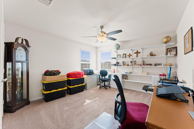 office with light carpet and ceiling fan