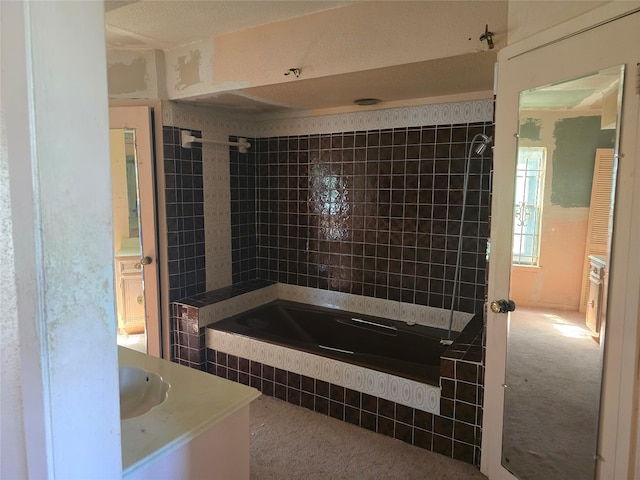 bathroom featuring shower with separate bathtub