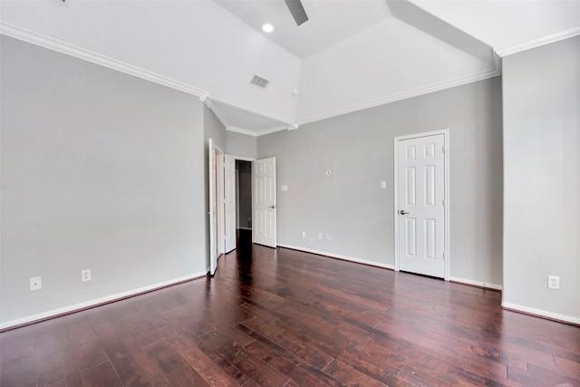 spare room with ornamental molding, dark wood-type flooring, and a high ceiling