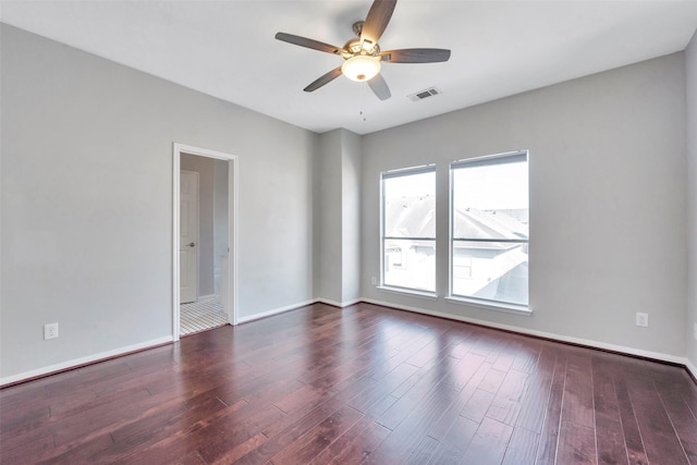 unfurnished room with ceiling fan and dark hardwood / wood-style floors