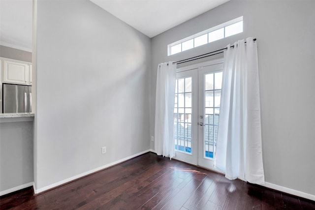 doorway to outside with dark hardwood / wood-style flooring and french doors