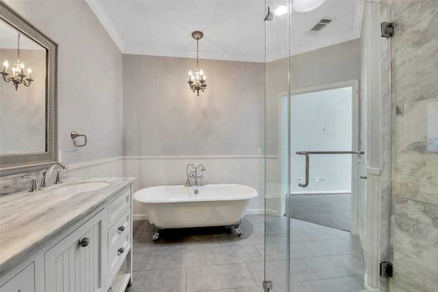 bathroom with vanity, tile patterned floors, ornamental molding, shower with separate bathtub, and a notable chandelier