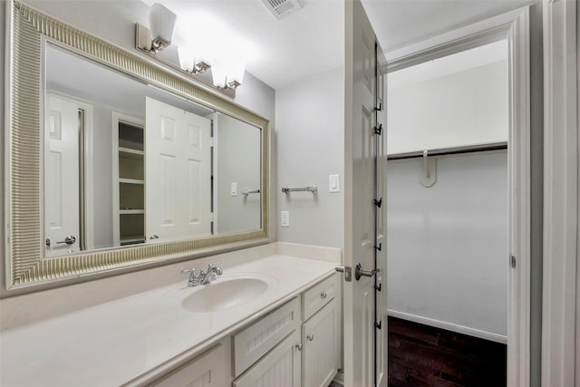 bathroom featuring vanity and hardwood / wood-style flooring