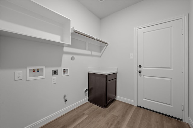 laundry room with light hardwood / wood-style flooring, washer hookup, hookup for a gas dryer, and hookup for an electric dryer