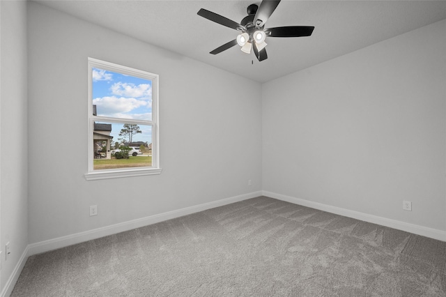 empty room featuring ceiling fan and carpet floors