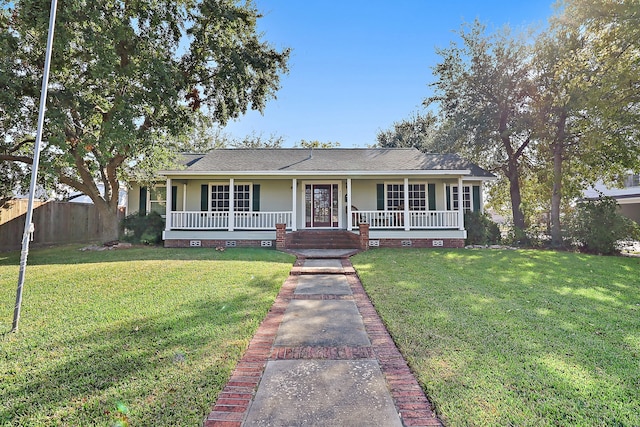 ranch-style house with a porch and a front lawn