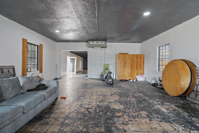 living room with a textured ceiling