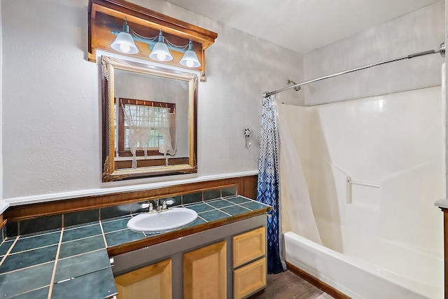 bathroom with vanity and shower / bath combo