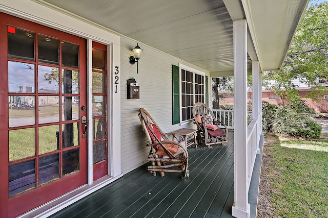 wooden terrace featuring a porch