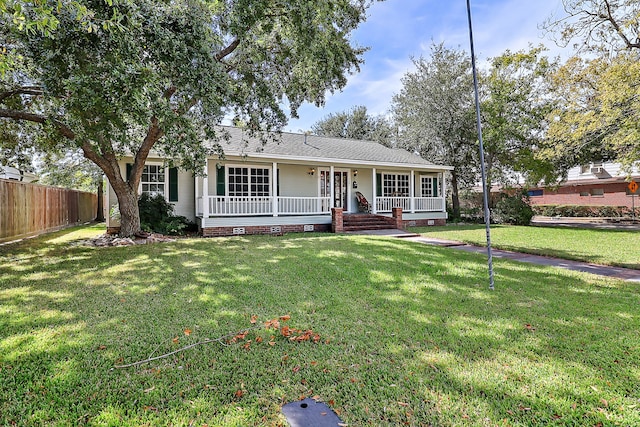 ranch-style house with a porch and a front lawn