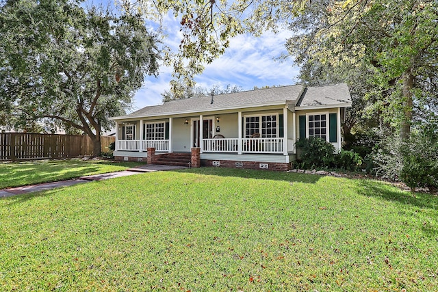 single story home featuring a front lawn and covered porch