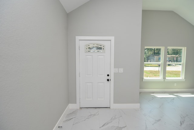 foyer entrance featuring lofted ceiling