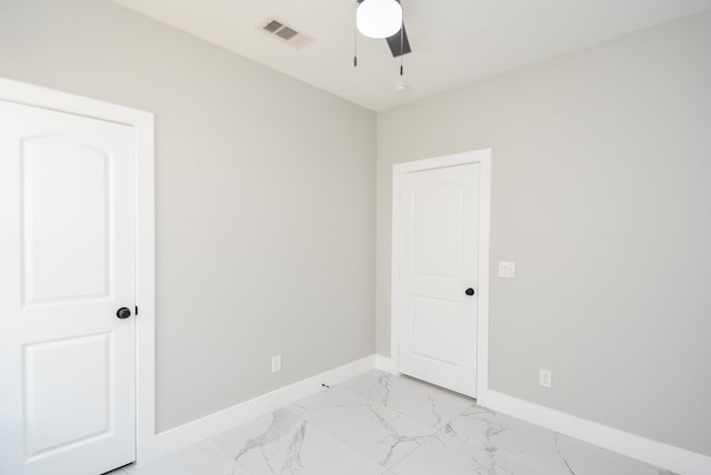 spare room featuring ceiling fan