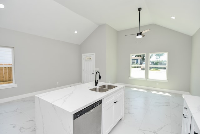 kitchen featuring sink, dishwasher, a kitchen island with sink, light stone counters, and white cabinets