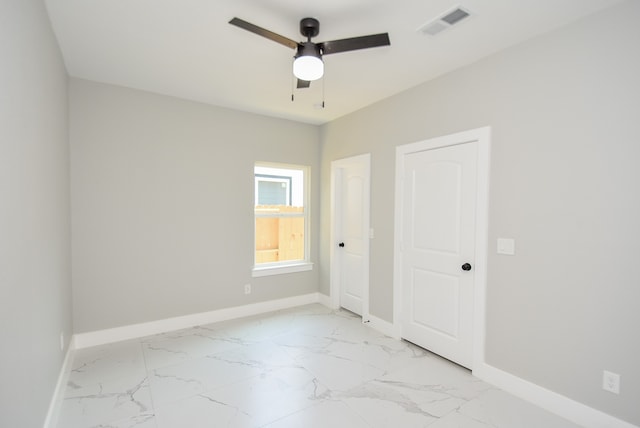 spare room with ceiling fan